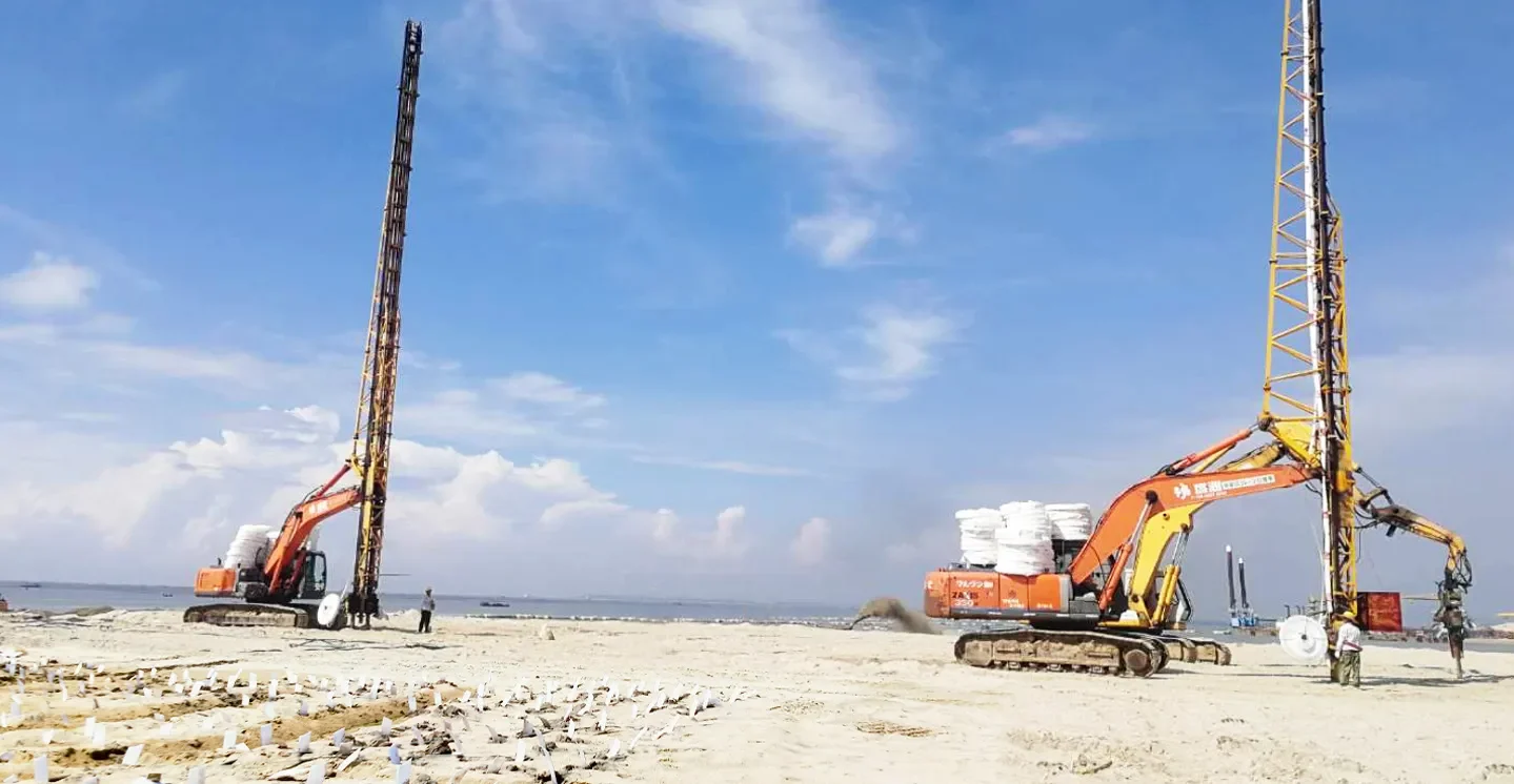 Vertical drain installation rig mounted on excavator